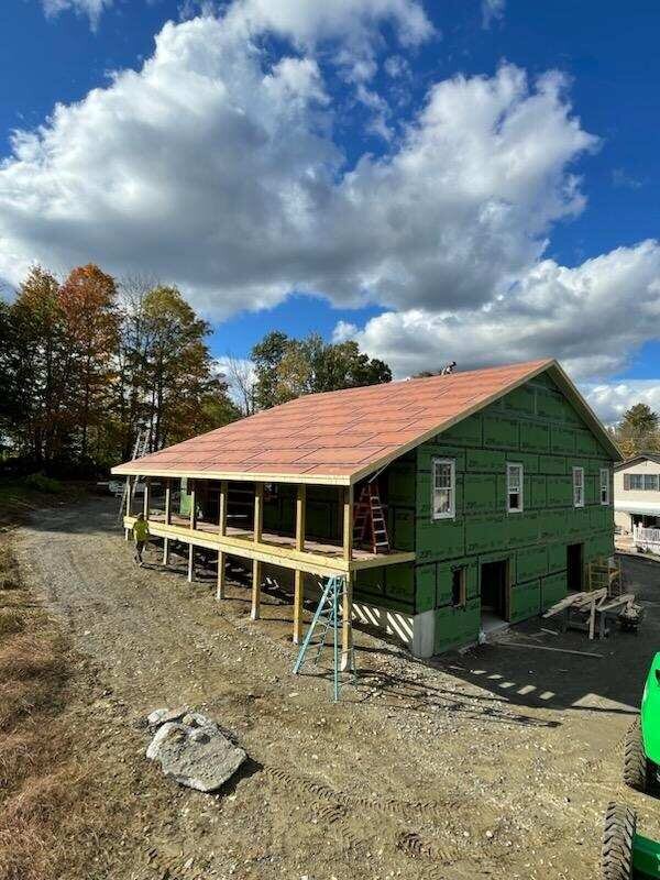 Whole-house elevation and structural addition by Milton's Construction