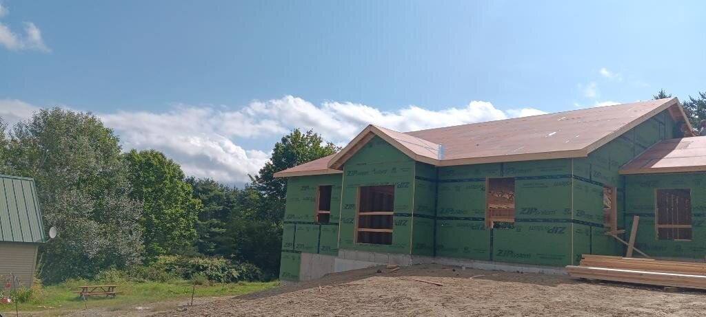 Completed home extension and new exterior by Milton's Construction — serving Nassau County
